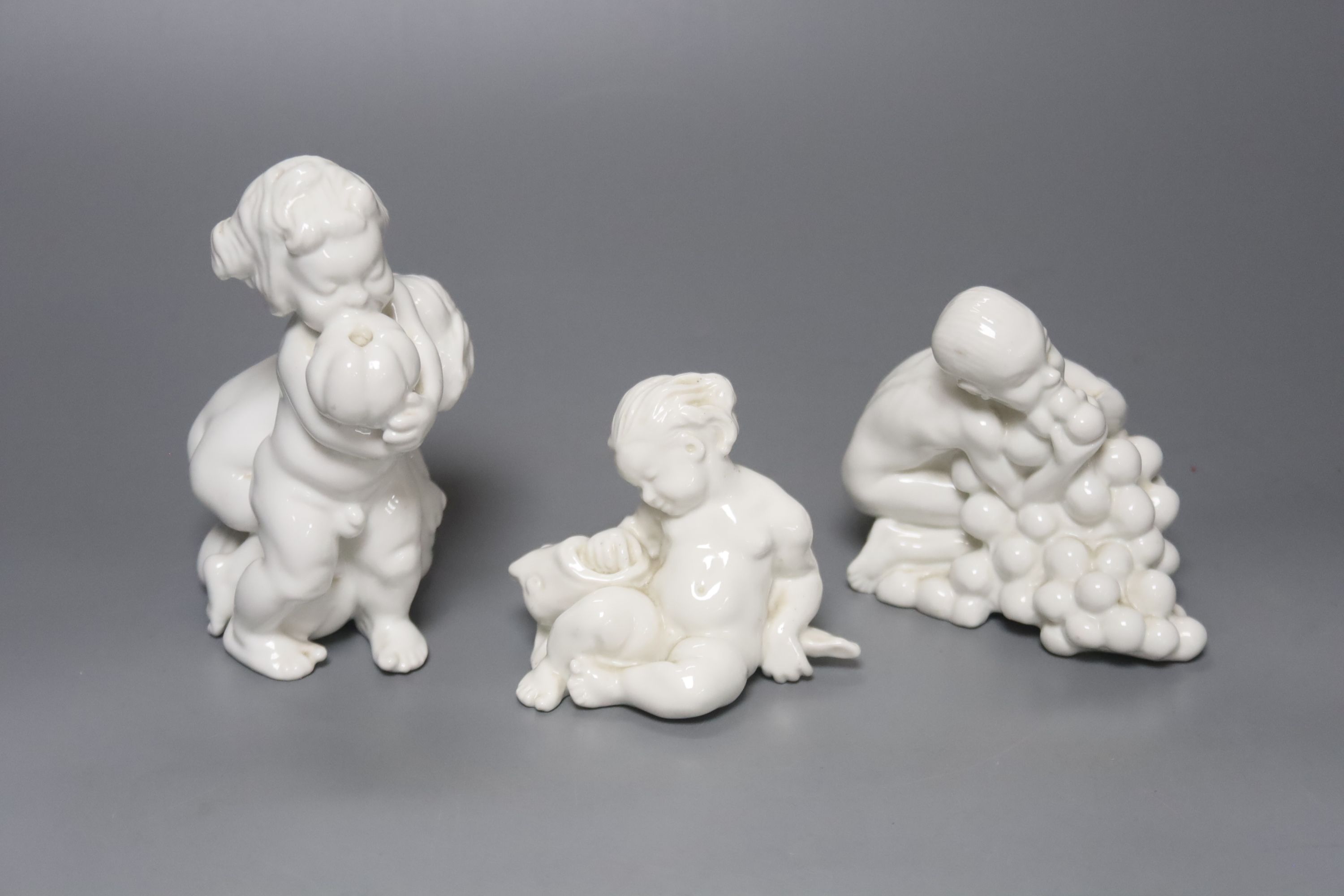 Kai Neilsen (1882-1924) for Bing & Grondahl, three white porcelain groups of children or cherubs, models 4021, 4033 and ?